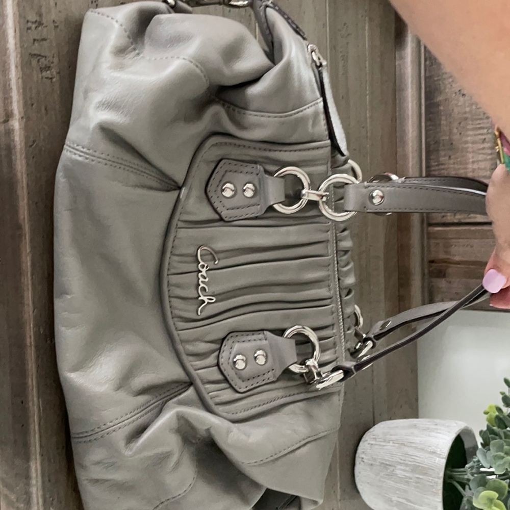 Grey coach purse.